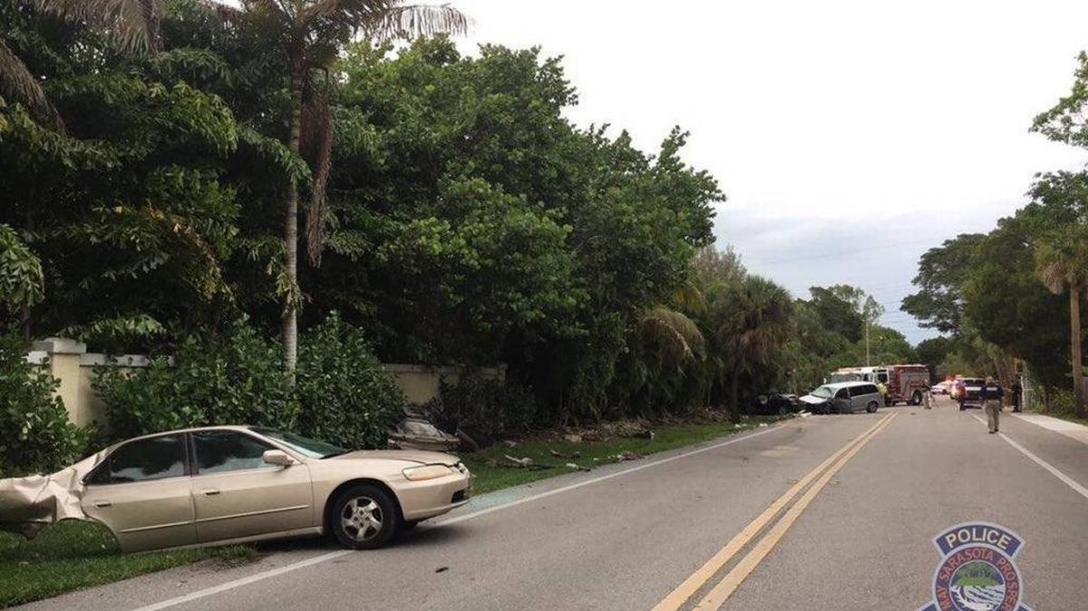 A three-vehicle crash closed a Sarasota intersection and the North Bridge to Siesta Key for several hours Wednesday night. Four men were taken to the hospital with serious injuries.