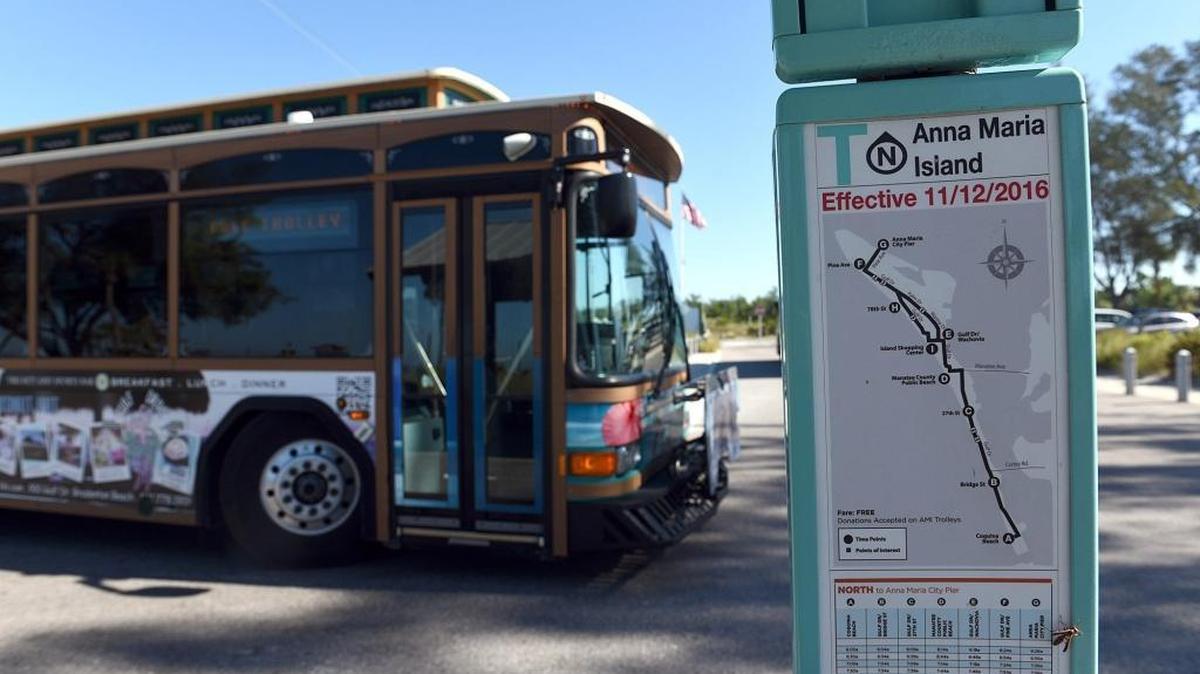 A trolley pulls up to a bus stop at Coquina Beach on Thursday. FDOT will present traffic alternatives as part of its Sarasota Manatee Island Barrier Traffic Study public information workshop on Tuesday.