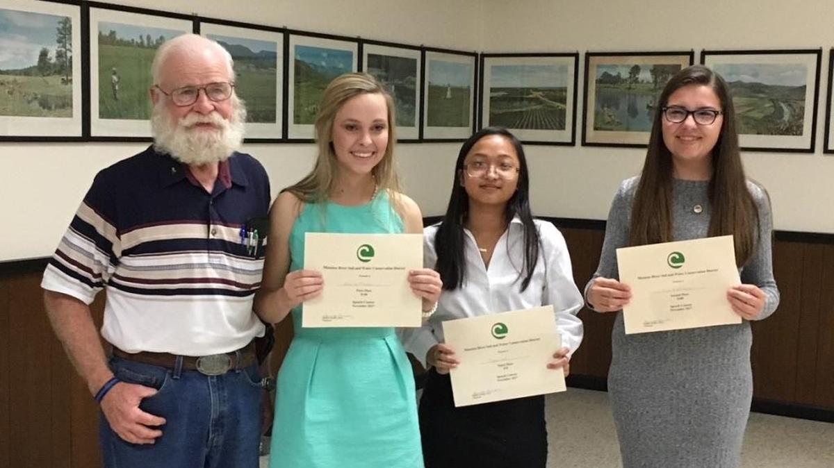 Manatee River Soil and Water Conservation District Vice-Chair John J. O’Connor, Jr. is shown with speech award winners Elanie Mason, Ngan Le, and Mia Kielmann.