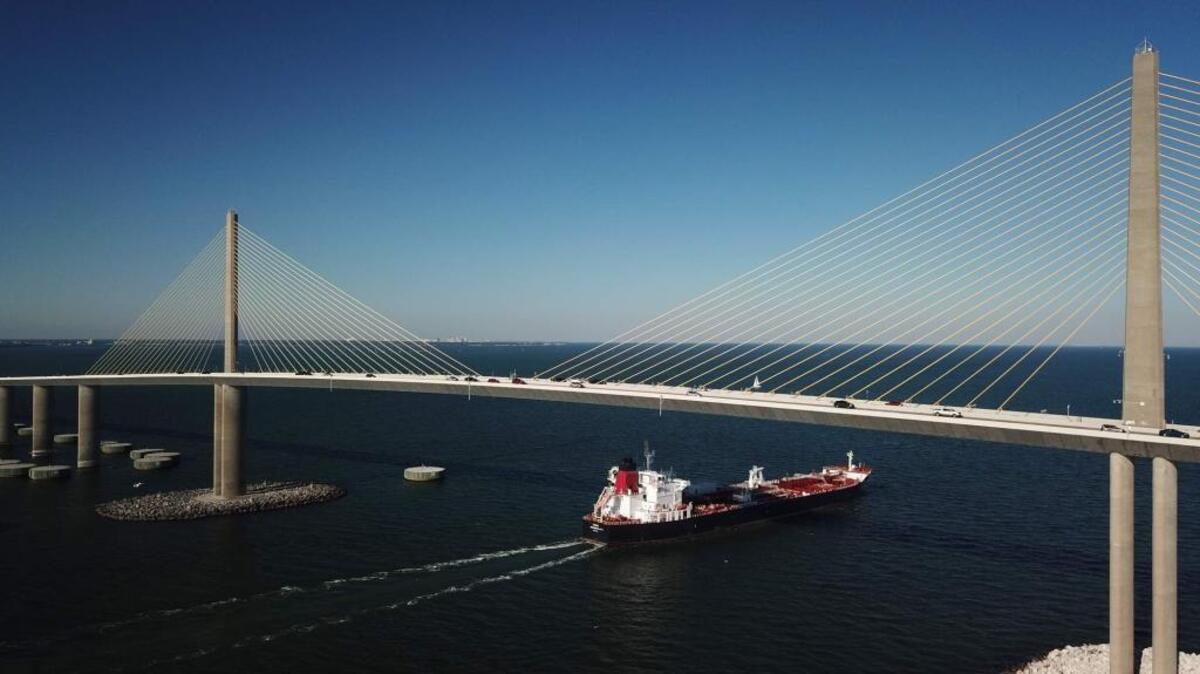 A ship passes underneath the Sunshine Skyway Bridge.