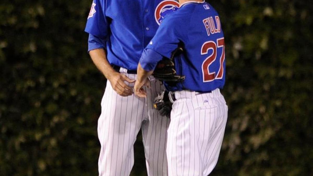 Chicago Cubs pitcher Sean Marshall left, talks with center fielder Sam Fuld after manager Lou Piniella put Marshall in left field during a doubleheader against St. Louis on July 23, 2009. Cubs manager Joe Maddon says he might use that strategy again after employing it in late June.
