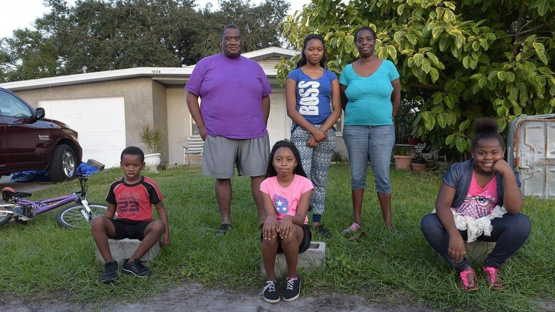 The Anderson family, Jared Sr., daughter Samiya, 14, wife Felicia, son Michael, 5, and daughters Da-Jaria, 10 and Jakiya, 7, in front of Jared’s father’s house in Palmetto. The family has been living on and off in motels because they cannot afford housing. Manatee County Commission discussed the county’s fair housing requirements during Tuesday’s commission work session.