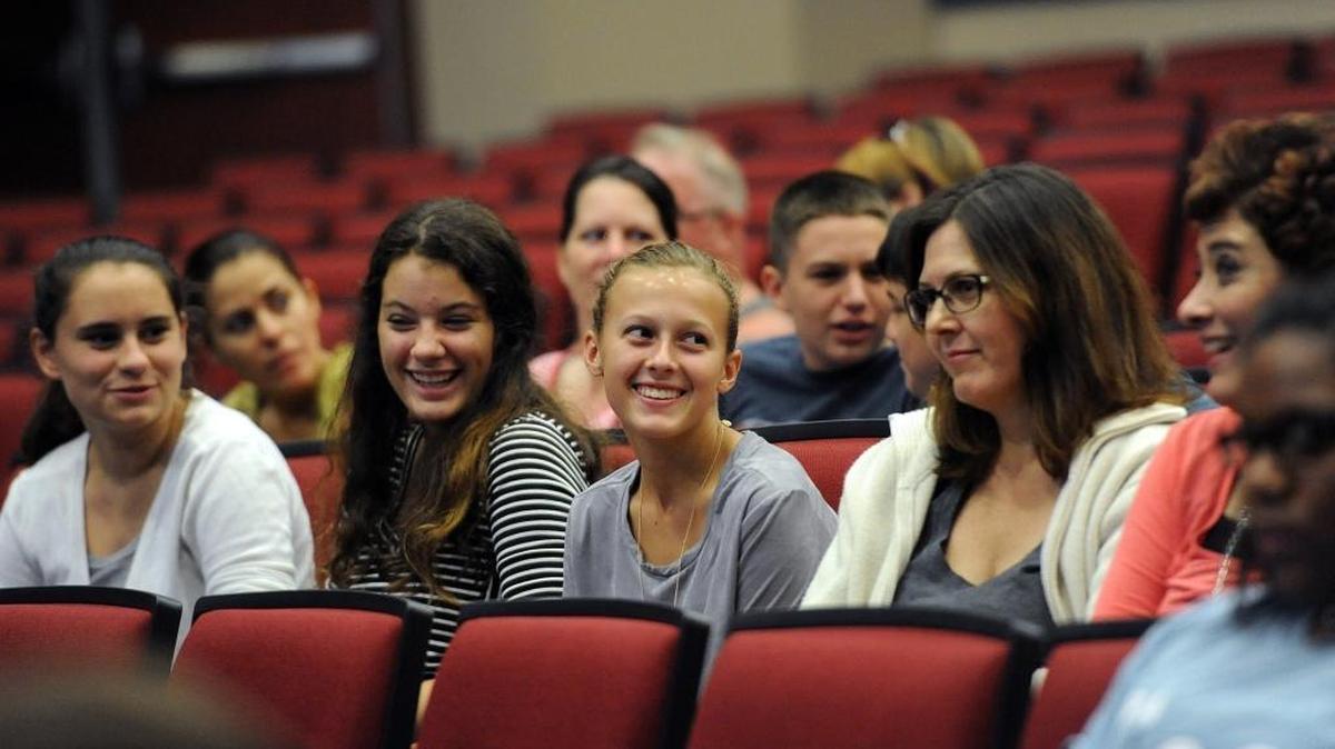 Members of Manatee High’s Marching Band and their parents smile as they learn they’ve been invited to perform in Italy in 2017 by Youth Music of the World during the New Year’s Day Festival and Parade in this photo shot in September.
