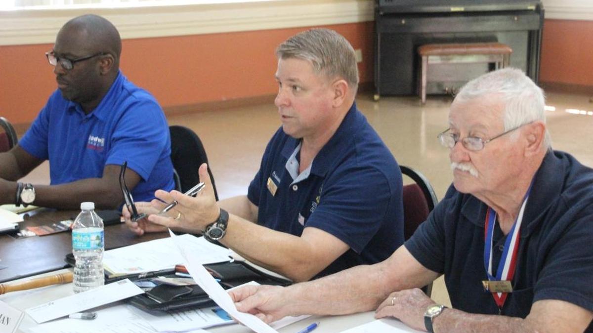 Carl Hunsinger, center, chairman of the Manatee County Veterans Council, has frequently spoken out about the need for a veteran ID card. Also shown are Edwin Robinson, left, and Stan Weyman.