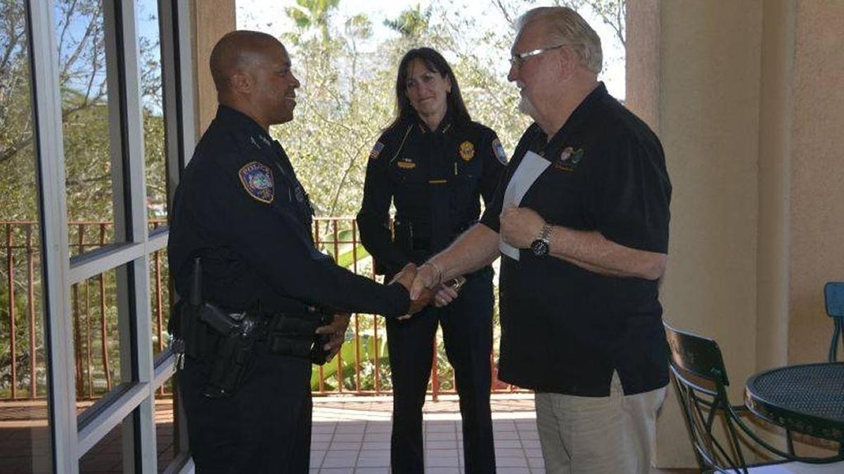 Bradenton Mayor and Police Commissioner Wayne Poston congratulates Officer Gregory Pryor after he was sworn in on Thursday.