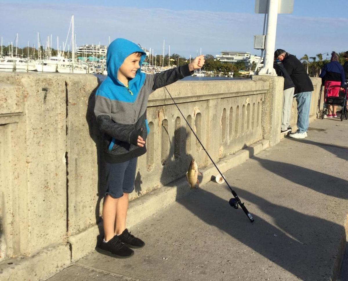 Logan Cole, 6, shows off his first catch of the day Saturday morning at the Hernando DeSoto Historical Society’s Little Anglers Fishing Tourney on the Palmetto fishing pier. The tournament is free and the kids go home with the fishing gear and it’s all part of the annual Bradenton Area River Regatta.