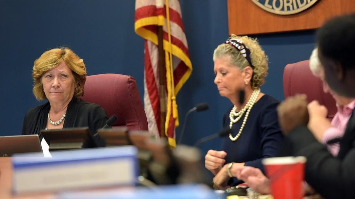 Betsy Benac listens as Charles Smith voices his belief that FPL failed in their response to Hurricane Irma at Monday morning's Manatee County Commission meeting.