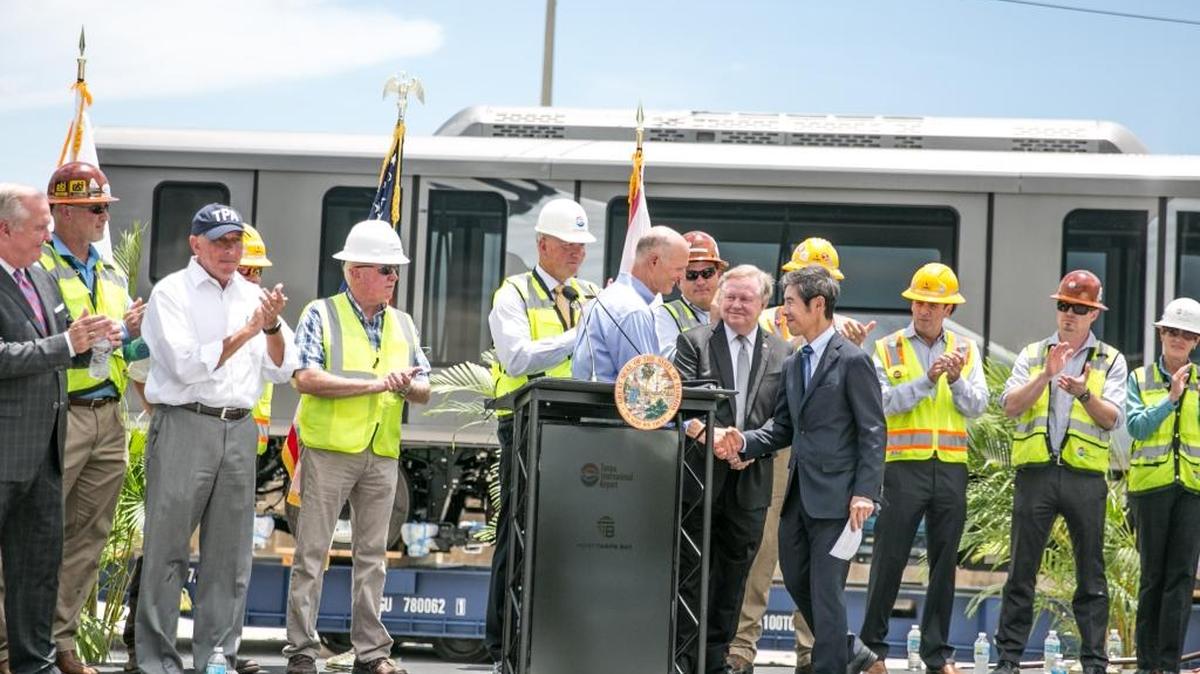 Japan Consul General Ken Okaniwa shakes hands with Gov. Rick Scott during a press conference at Port Tampa Bay on Monday.