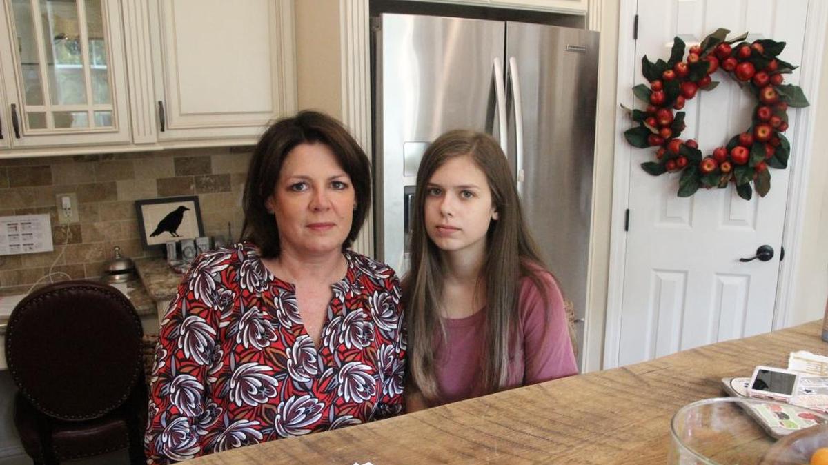 Lily O’Neal, right, at home with mother Tracy O’Neal in 2017 after surviving an E. coli sickness from I.M. Healthy Soy Nut Butter that put her in a hospital for 23 days.