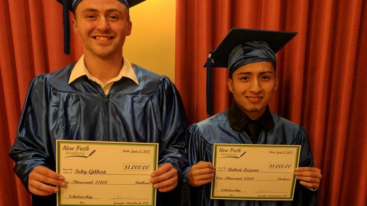 Toby Austin Gilbert (left) and Robert Lujano (right) graduated from New Path Academy Friday and were awarded with $1,000 scholarships to help continue their education.