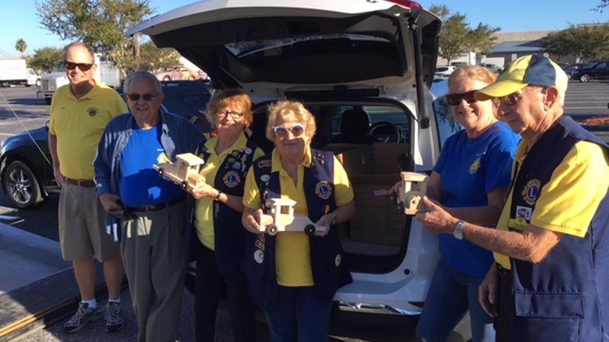 Bradenton Lions Club members were busy receiving toys from T.L.C. on Saturday.
