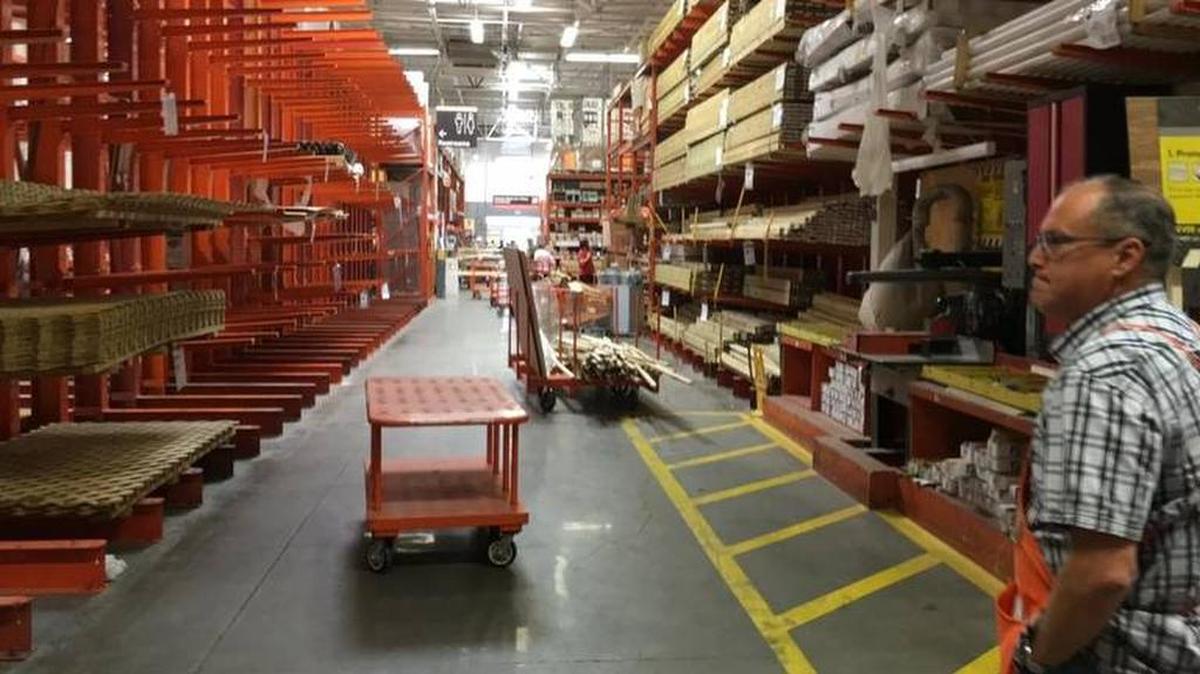A few days before the possible arrival of Hurricane Irma in Florida, Sean Brown, right, the store manager of the Home Depot on Cortez Road in Bradenton, gazes almost disbelieving at the completely sold out shelves of plywood on the left side of the lumber isle. Brown has been store manager since 1991 and said he has never seen the plywood all gone.