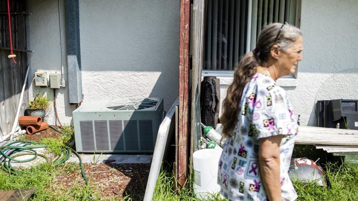 Roberta Jackson, owner, walks past one of the air conditioning units at the Serenity Gardens nursing home on Thursday afternoon in Bradenton. Governor Rick Scott has ordered all nursing homes to have backup generators in place by mid-November after 10 residents died at a Hollywood Hills nursing home after losing power from Hurricane Irma.