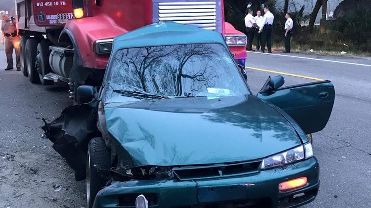 A man died Wednesday morning after he was struck by a dump truck while trying to push his stalled out vehicle out of the road. The crash has shut down a portion of U.S. 301, according to Hillsborough County deputies.