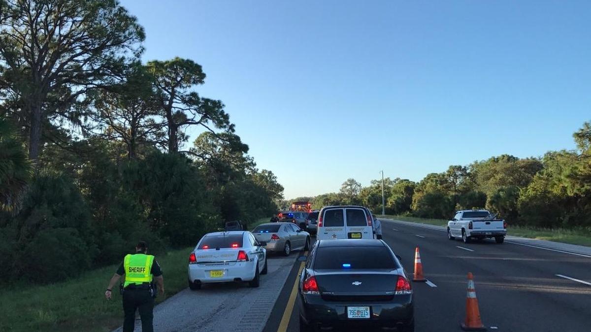 Emergency vehicles are parked on Interstate 75 south of Clark Road where a vehicle fire and fatality was reported Sunday morning.