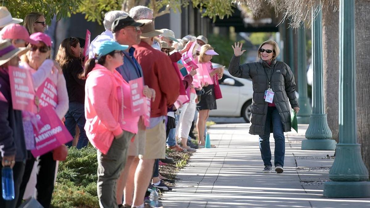 In this file photo, Planned Parenthood Southwest and Central Florida CEO Barbara Zdravecky cheers supporters who stood in solidarity in February outside the Sarasota clinic, outnumbering protestors a day ahead of the protests planned across the country the following day.