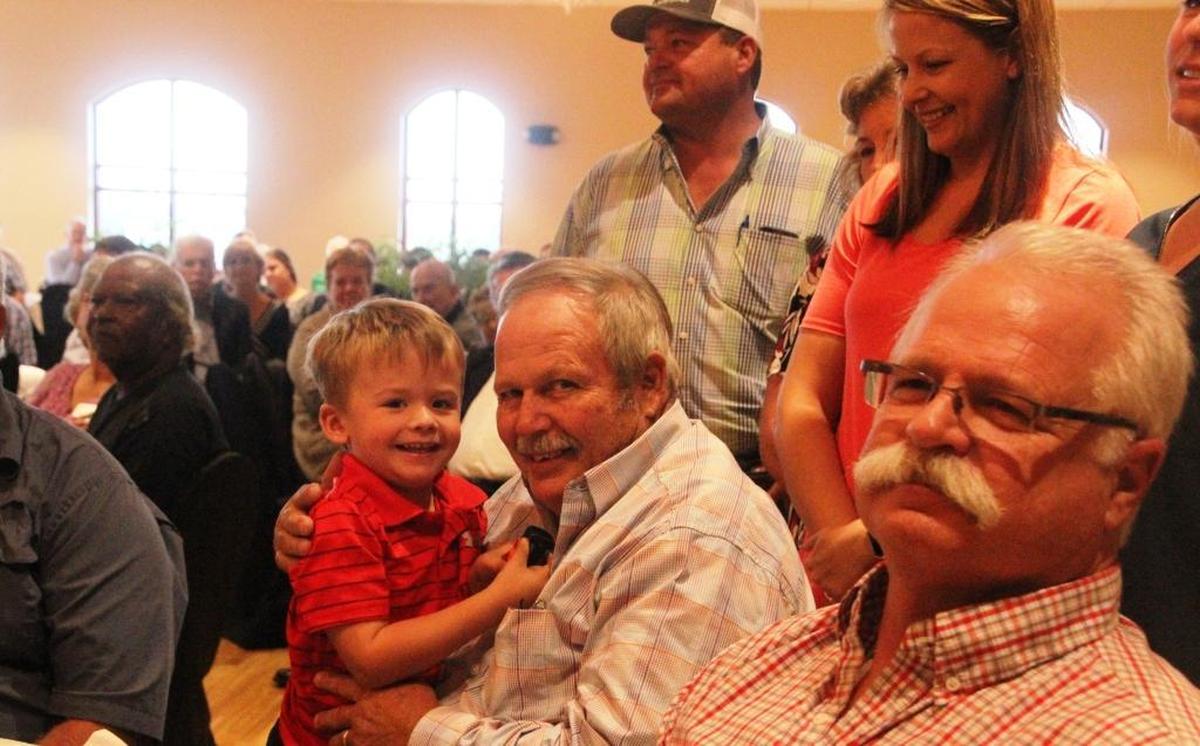 Mitchell John was surprised with the 2017 Outstanding Agriculturist of the Year Award on Tuesday. Organizers kept his family out of sight until the award announcement was made. Standing behind John his is family, and sitting in his lap is his grandson, Conner Dorman, 2, from Pasco County.