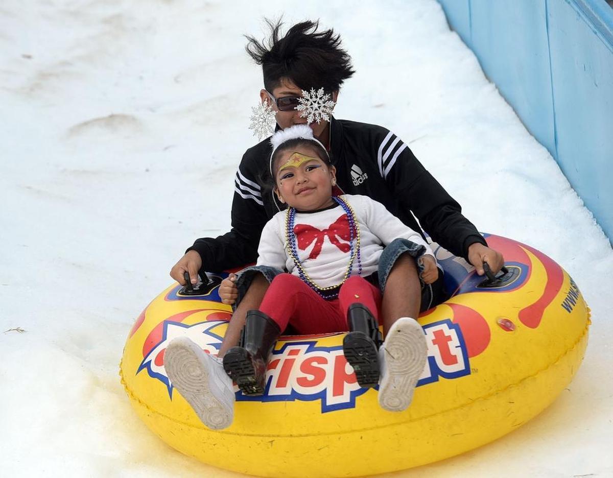 Children enjoyed a snowy ride at the annual Flight to the North Pole Christmas celebration for children with illnesses, hosted by the Manatee County Sheriff's Office, Thursday at the Sarasota/Bradenton Airport Fire Station.