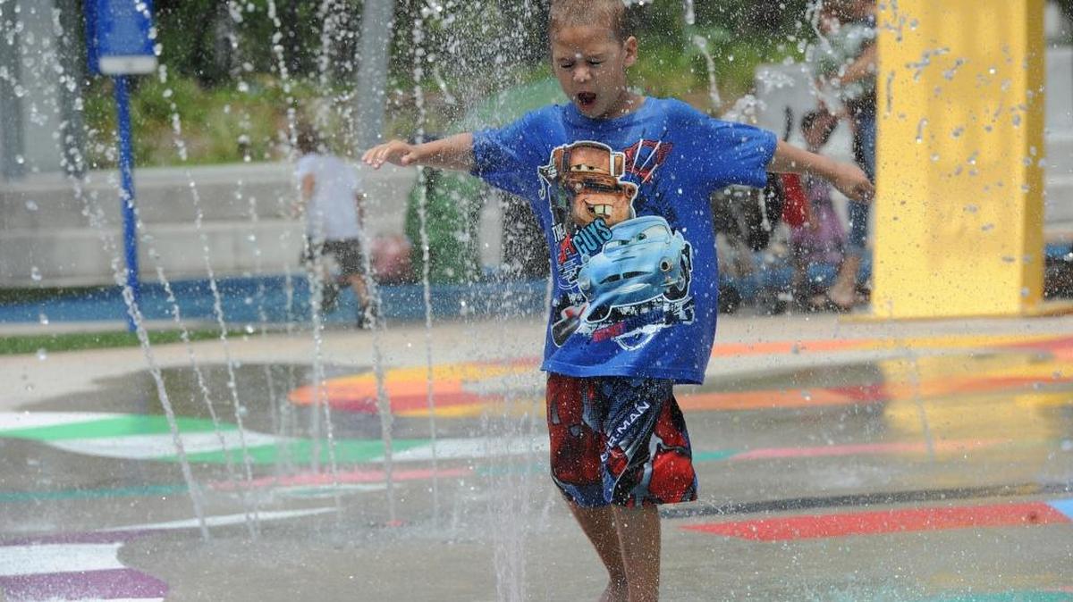 A youngster frolics in the Splash Pad at Bradenton’s Riverwalk.