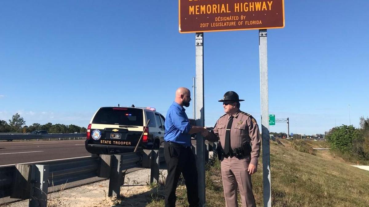 Florida Highway Patrol Lt. Benedict Thomas’ son, B.J. Thomas, shakes the hand of Col. Spaulding after his father was honored with the renaming a portion of Interstate 75 near Fowler Avenue as the Lietunant Benedict Thomas Memorial Highway.