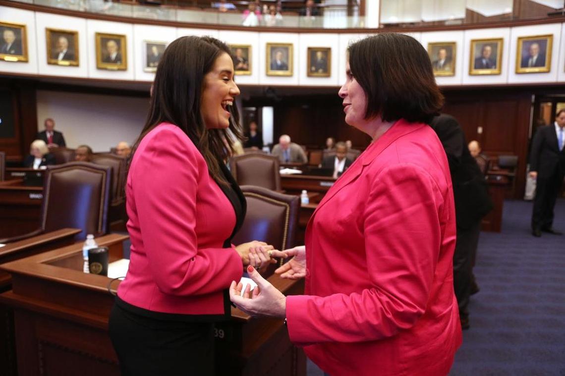 Miami Republican Sen. Anitere Flores, left, reacts with Sen. Kelli Stargel, R-Lakeland, after the Senate passed a sweeping education bill Thursday, May, 4, 2017, which seeks to address excessive testing in public schools and also incorporates other policies, such as required daily recess in elementary schools.