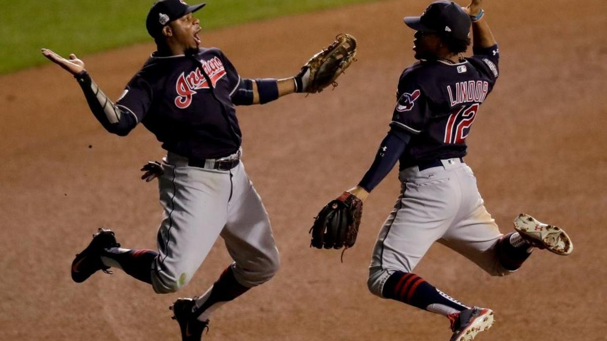 In this Oct. 29 file photo, Cleveland Indians left fielder Rajai Davis, left, and shortstop Francisco Lindor celebrate their win after Game 4 of the Major League Baseball World Series against the Chicago Cubs. Taco Bell is handing out a free Doritos Locos taco in celebration of Lindor’s stolen base during Game 1.