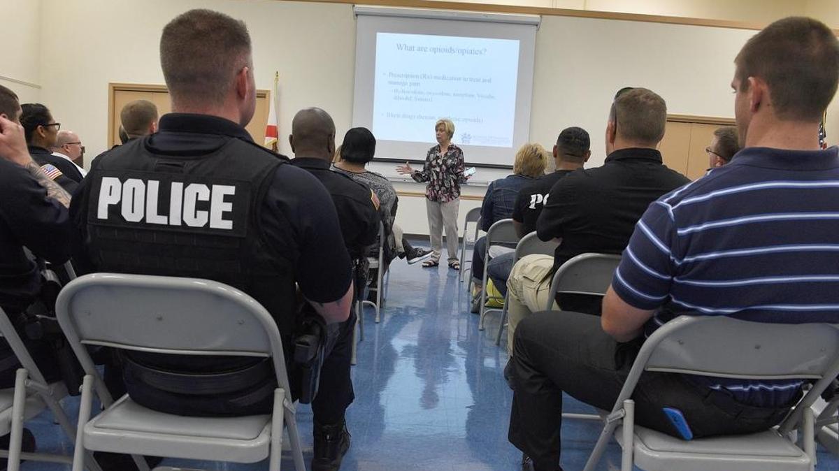 Officers from Bradenton and Palmetto attend a Drug Free Manatee event Thursday to learn more about the opioid epidemic and how to distribute Narcan in the case of an overdose.
