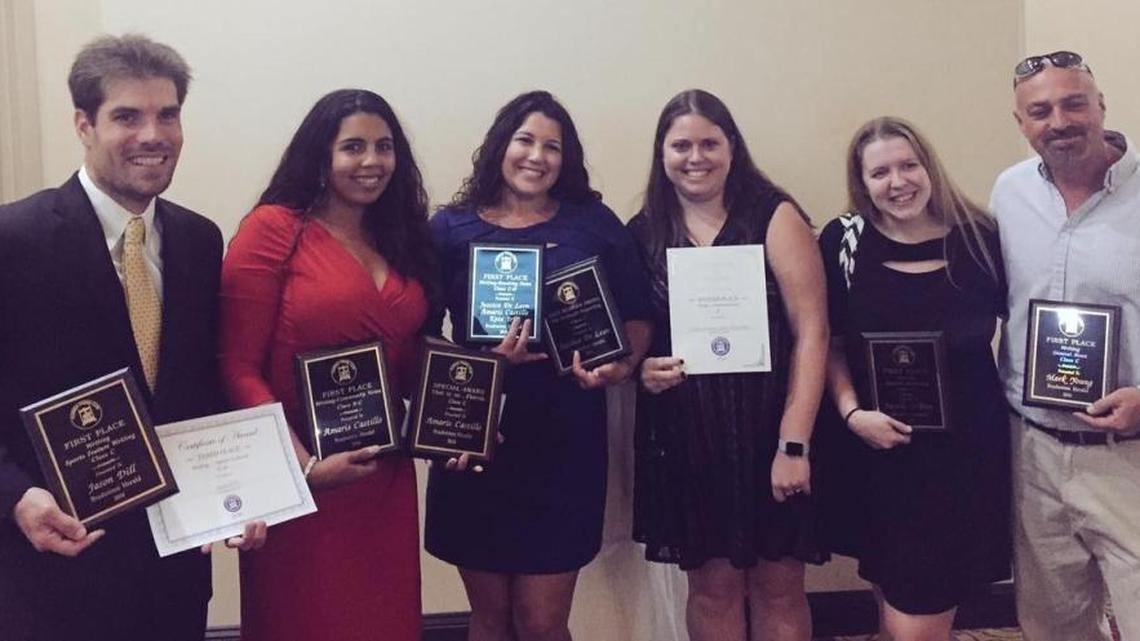 Bradenton Herald journalists display their awards Saturday in St. Augustine. From left are sports reporter Jason Dill; news reporters Amaris Castillo, Jessica De Leon and Claire Aronson; business reporter Janelle O’Dea; and news reporter Mark Young.