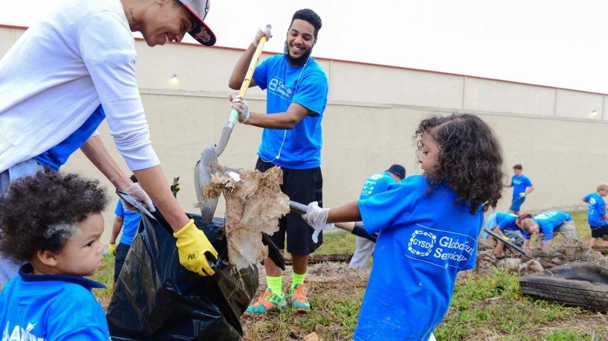 Volunteers Brittney Davis, Kevin Jahoda and their kids Kalil and Khyani help clean up Ludlam Trail on Global Youth Service Day Saturday, April 16, 2016. The Ludlam Trail project may get $2.5 million in the next state budget, but that could change.