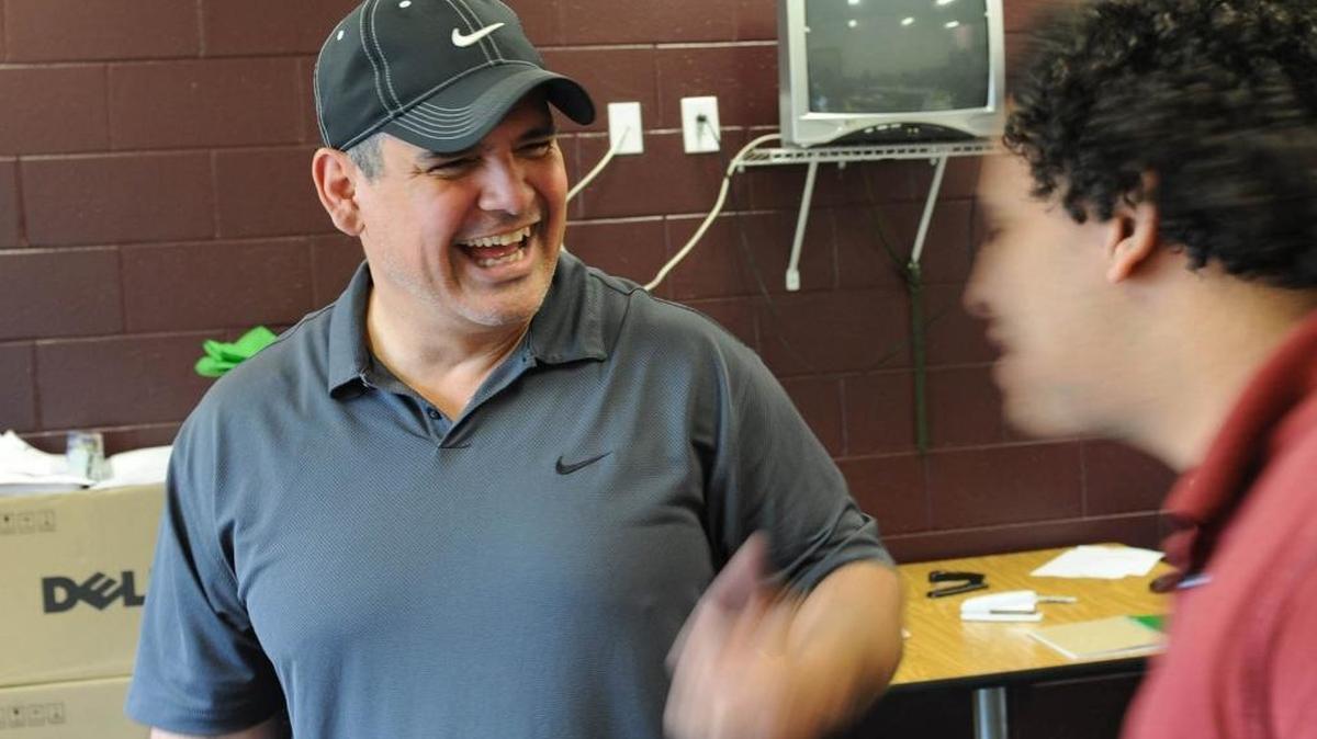 Jerry Parrish, talks with a student at the Y School in Bradenton. Parrish deals daily with at-risk youth and their families, focusing on gang prevention and education.
