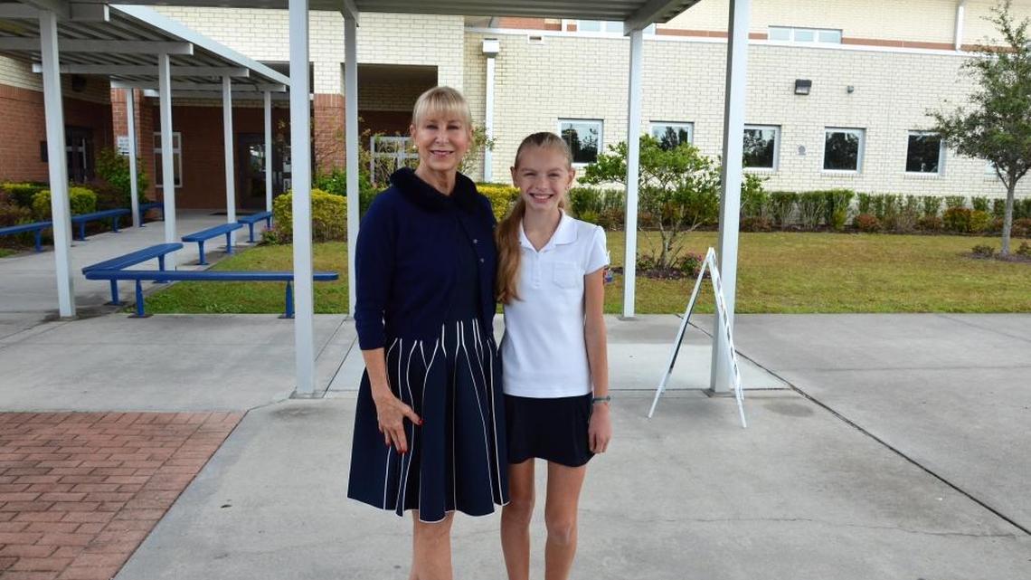 Florida First Lady Ann Scott, left, wife of Gov. Rick Scott, was escorted into Willis Elementary School in Lakewood Ranch Tuesday to read to students. Willis student Savannah Adams, right, had the honor of escorting the First Lady.