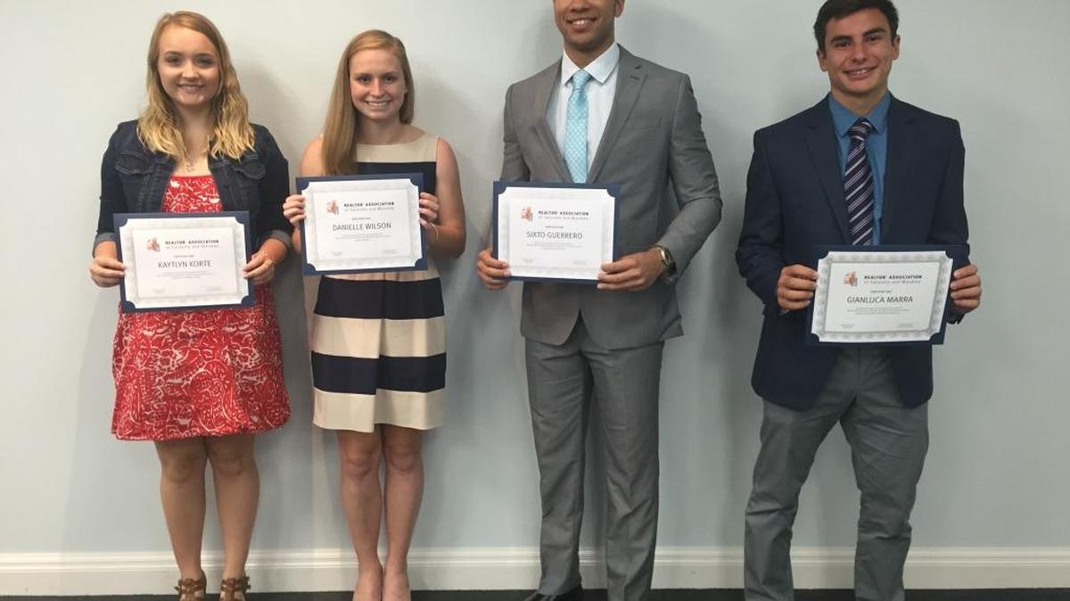 Four of six local students awarded scholarships by the Realtors Association.