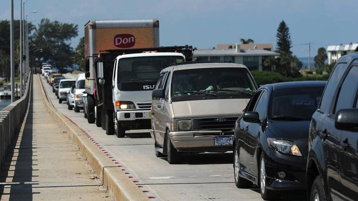 Traffic waits on the Cortez Bridge as the drawbridge opens for a sailboat traveling along the Intracoastal Waterway in this 2013 file photograph.