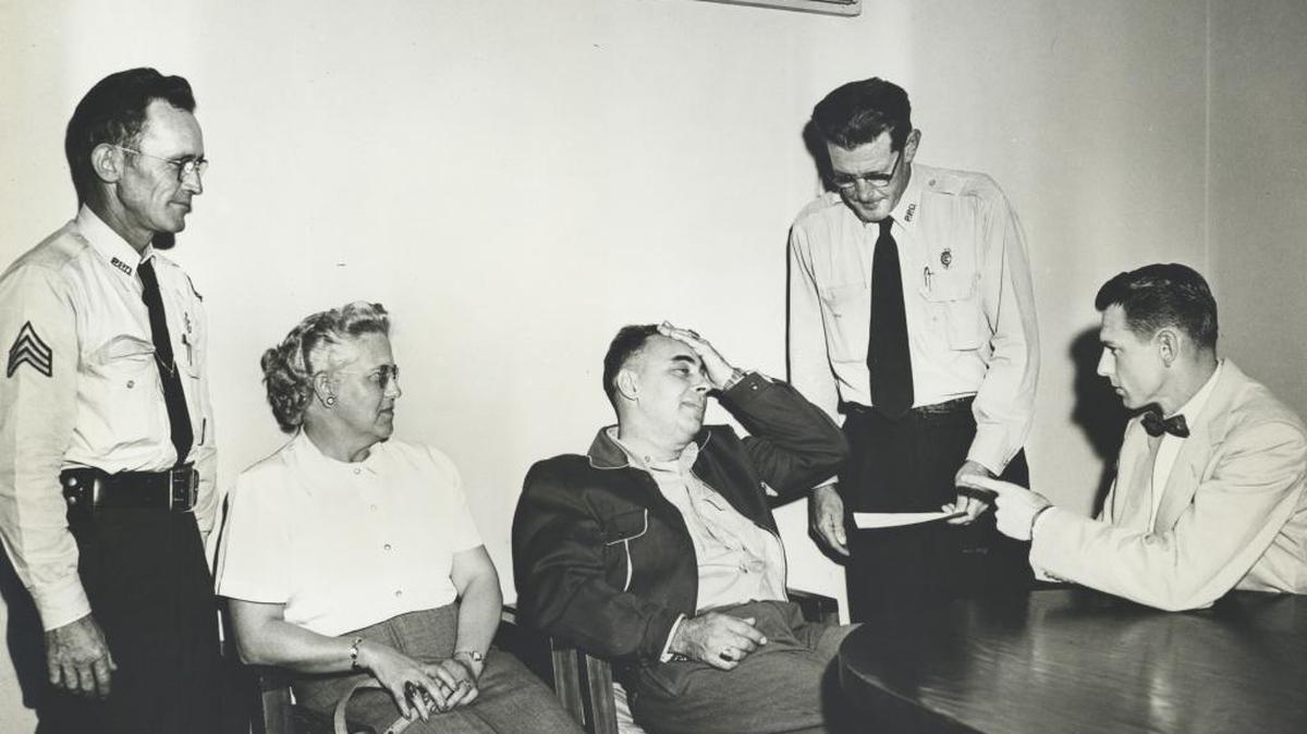 Hospitality speed arrest of Mr. and Mrs. Preiss of Iowa City on Feb. 22, 1955. Pictured (from left): Police Sgt. J.B. Sutton, Mrs. Preiss, Mr. Preiss, Chief of Police A.L. Redmon, and acting Judge Bob Marshall.