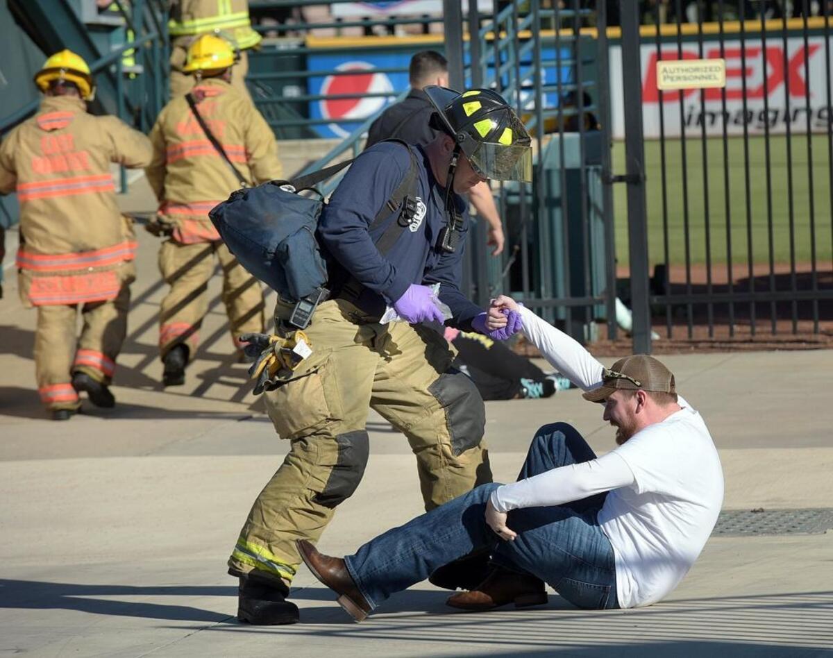 Responders evacuate volunteer casualties during Operation Inshore Slam, a full-scale exercise to test the response from local emergency responders to a multi-casualty terrorism event unfolds Wednesday at LECOM Park.