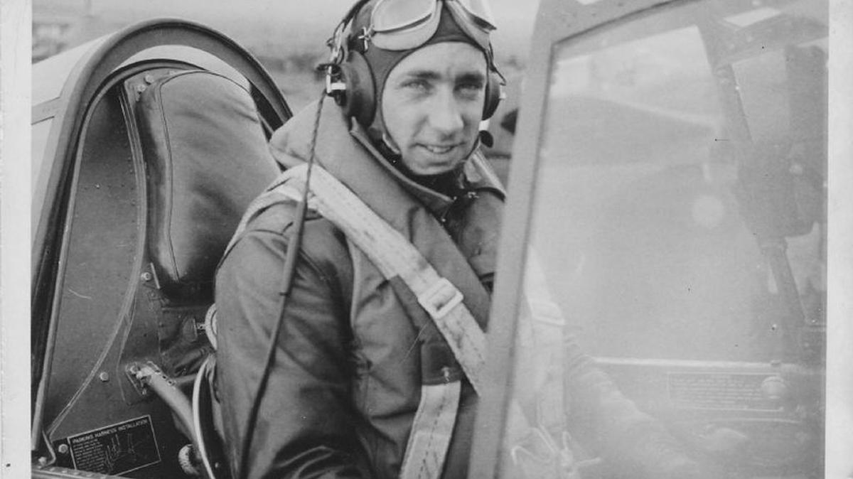 Fighter pilot Robert W. Lynch of the Royal Canadian Air Force is shown in his Kittyhawk fighter.