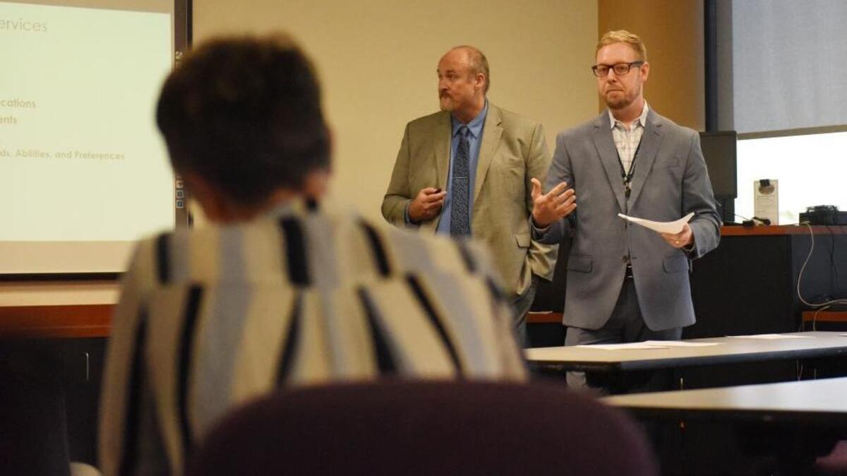 Joshua Barnett, right, speaks to about a dozen local leaders and interested parties in late 2017 during a pre-solicitation, informational meeting on the Opioid-focused Recovery Peer Coach Pilot Program.