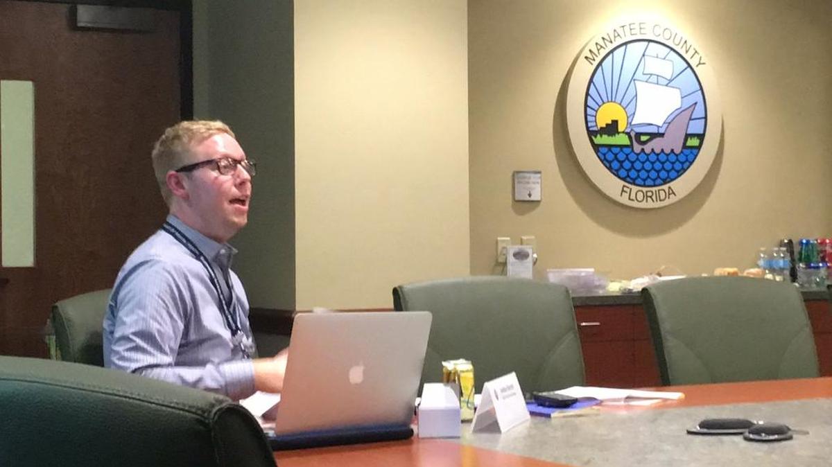Joshua Barnett, above, Manatee County's new health care services manager, addresses the Manatee Healthcare Advisory Board Wednesday. Barnett is proposing new ideas to help the board reach its goal of solving the county's indigent care issues.