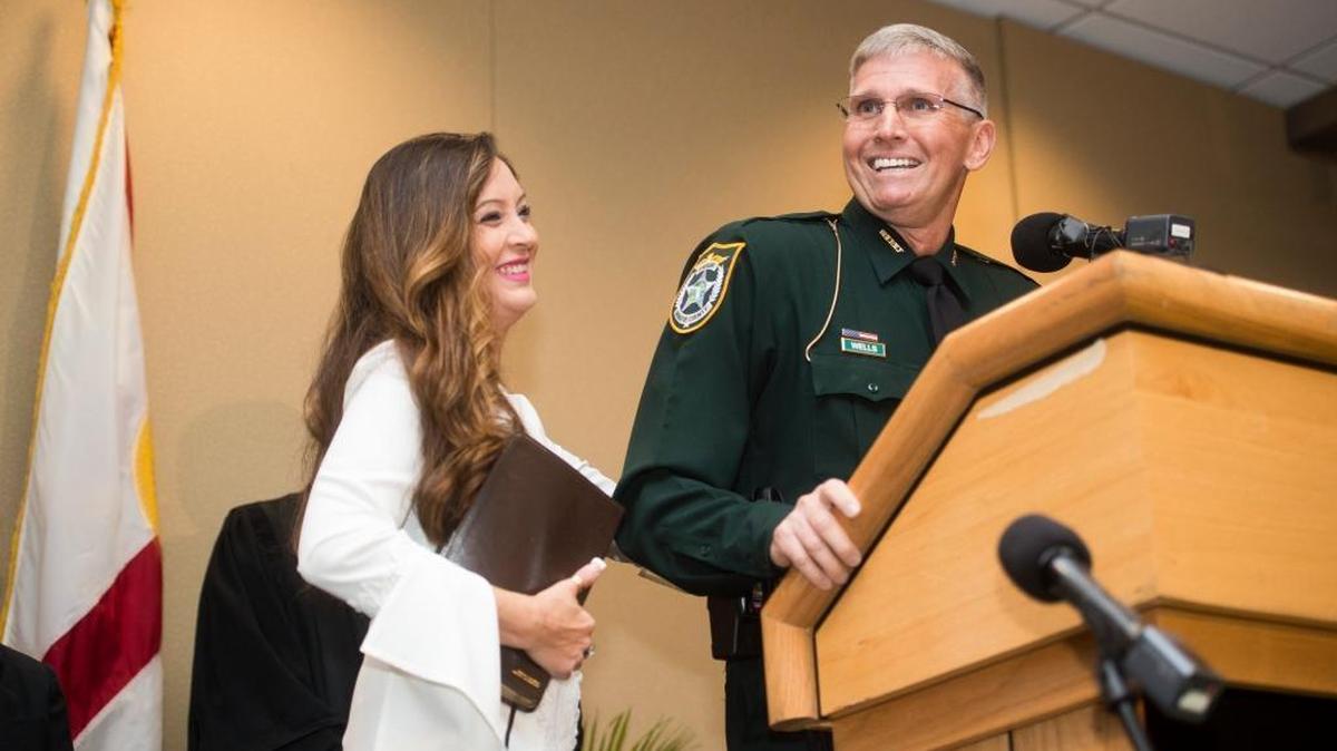 Rick Wells speaks to the crowd with his wife Lupita Wells after being sworn in as Manatee County Sheriff by Judge Gilbert Smith Jr. on Tuesday morning, January 3, 2017 at the Bradenton Area Convention Center in Palmetto.