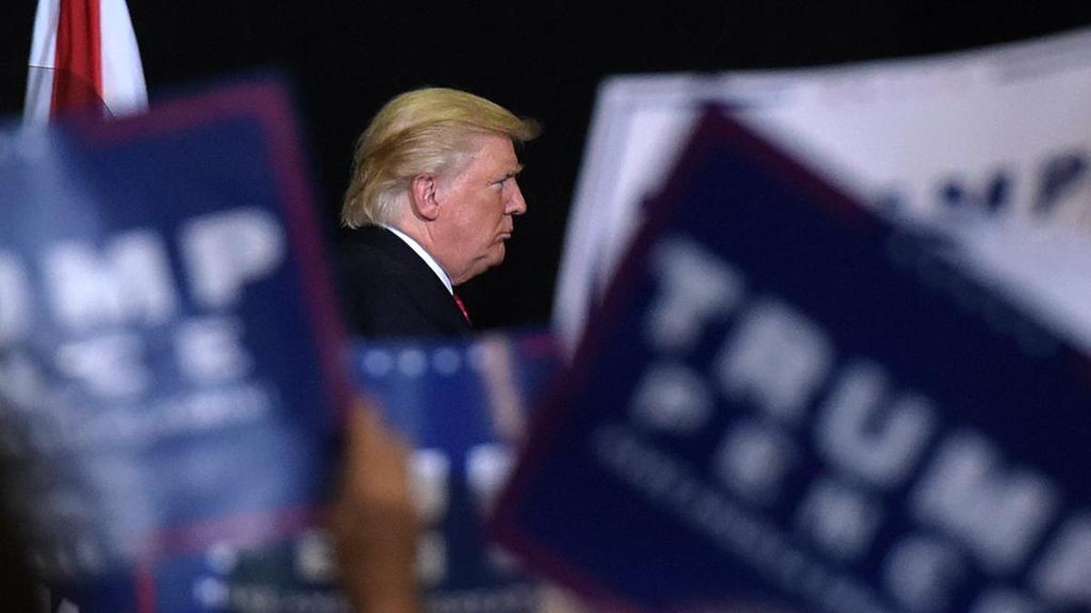 Donald Trump takes the stage at a campaign stop in Tampa at the State Fairgrounds Thursday.