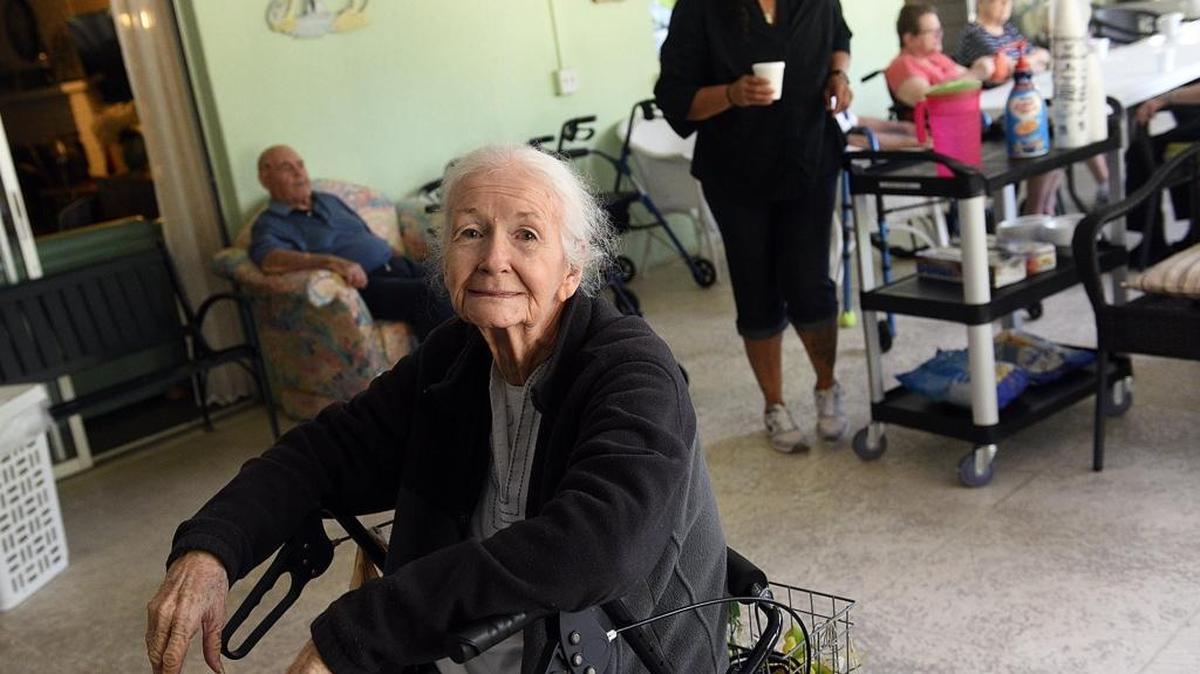 Sheila Overcash smiles Thursday despite the heat and lack of power. Sunny Bower Assisted Living and Senior Day Services in Bradenton is still without power Thursday. They say others on their street have power.