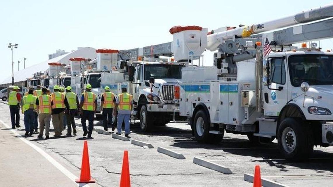 Florida Power and Light crews gather at a staging area.