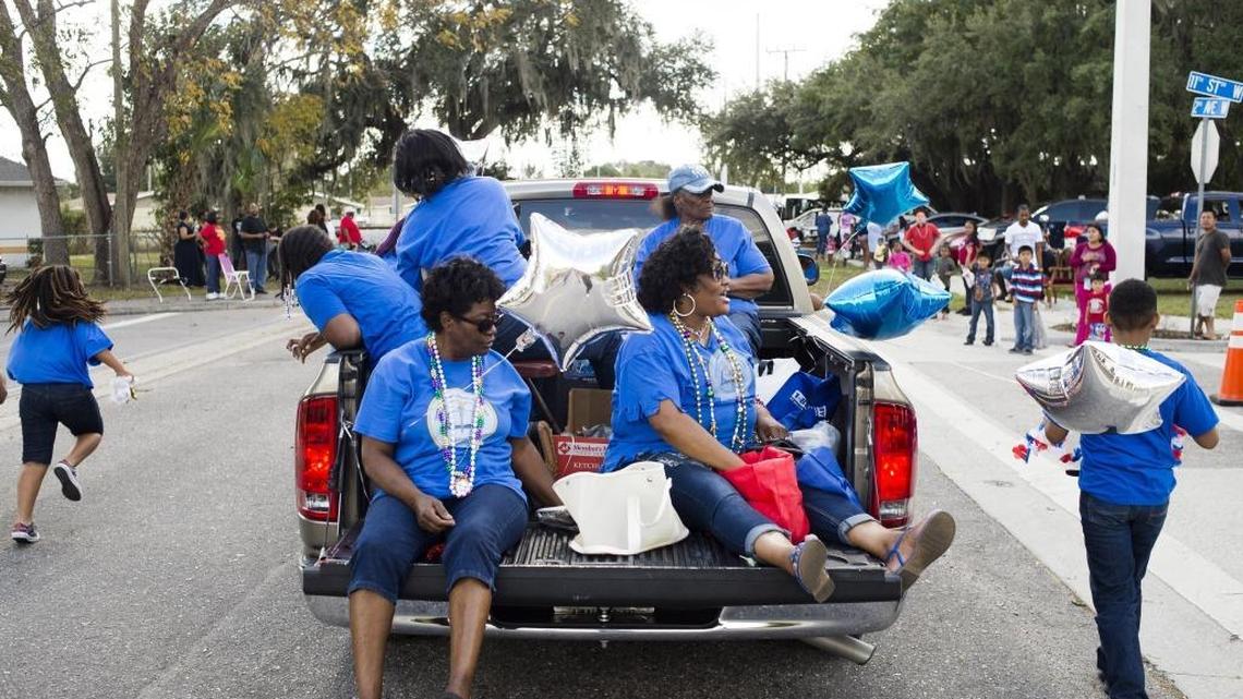 It’s legal to ride in the back of a pickup truck that’s in a parade, like this Florida church group.