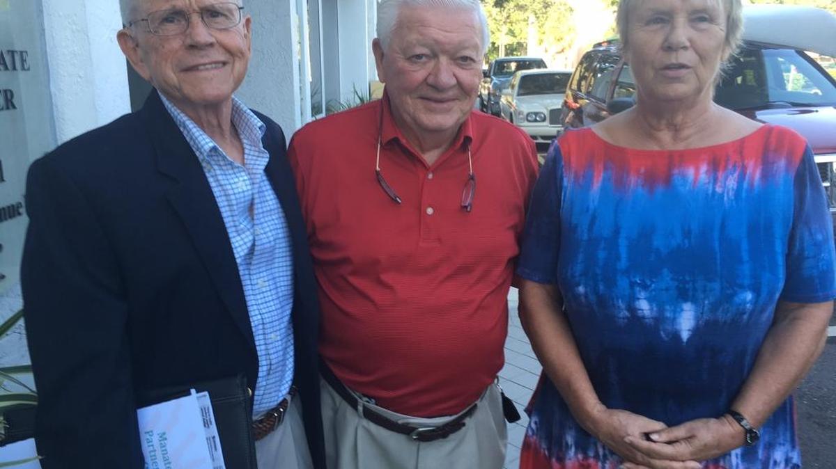 From left, Len O'Hara, Dr. Richard Conard and Sue Kolze are among the volunteers who over the last year helped create a free pet clinic on Nov. 11 at Braden River High School.
