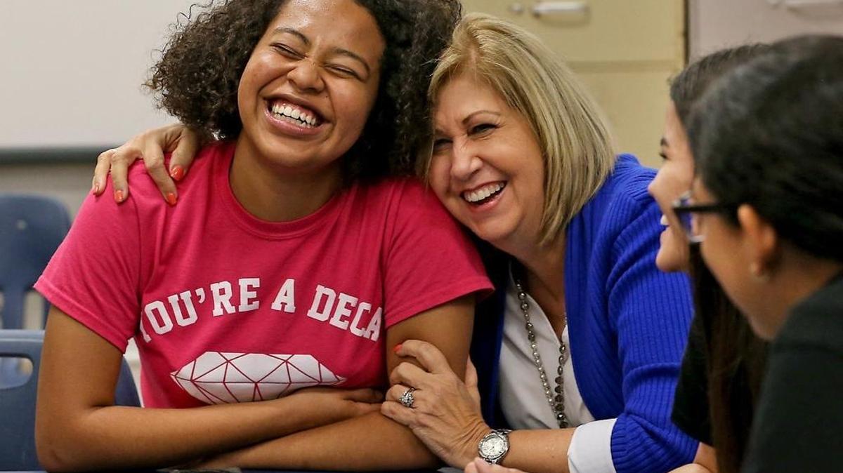 Hialeah High school senior Gabriela Fowler, 17, gets a hug from her college adviser Alina Grandal on Tuesday, March 14, 2017, as they discuss the difficulties minority and low-income students face in paying for college in Florida now that the eligibility criteria for the Bright Futures scholarship program has changed.