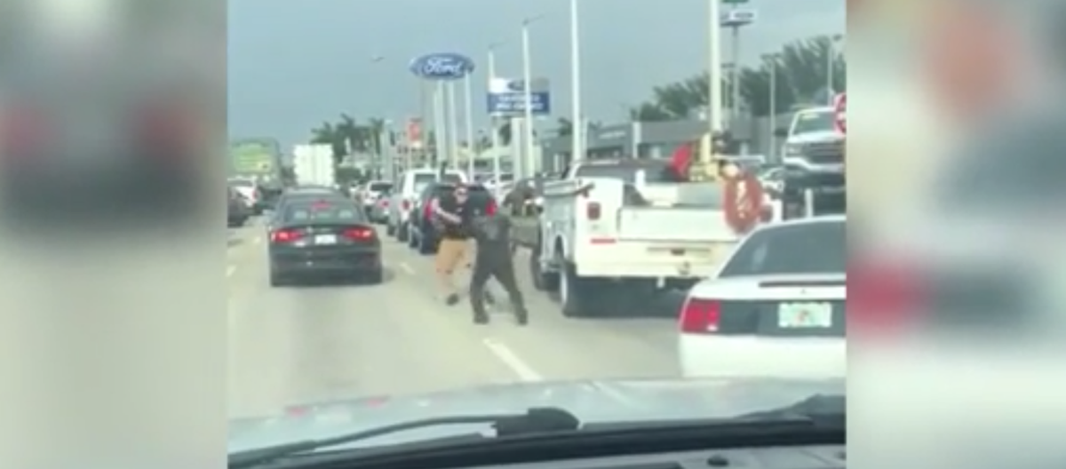 Hector Herrera, 24, and Jiaro Linarte, 50, fight over a baseball bat in Hialeah after a road rage dispute escalated in June.