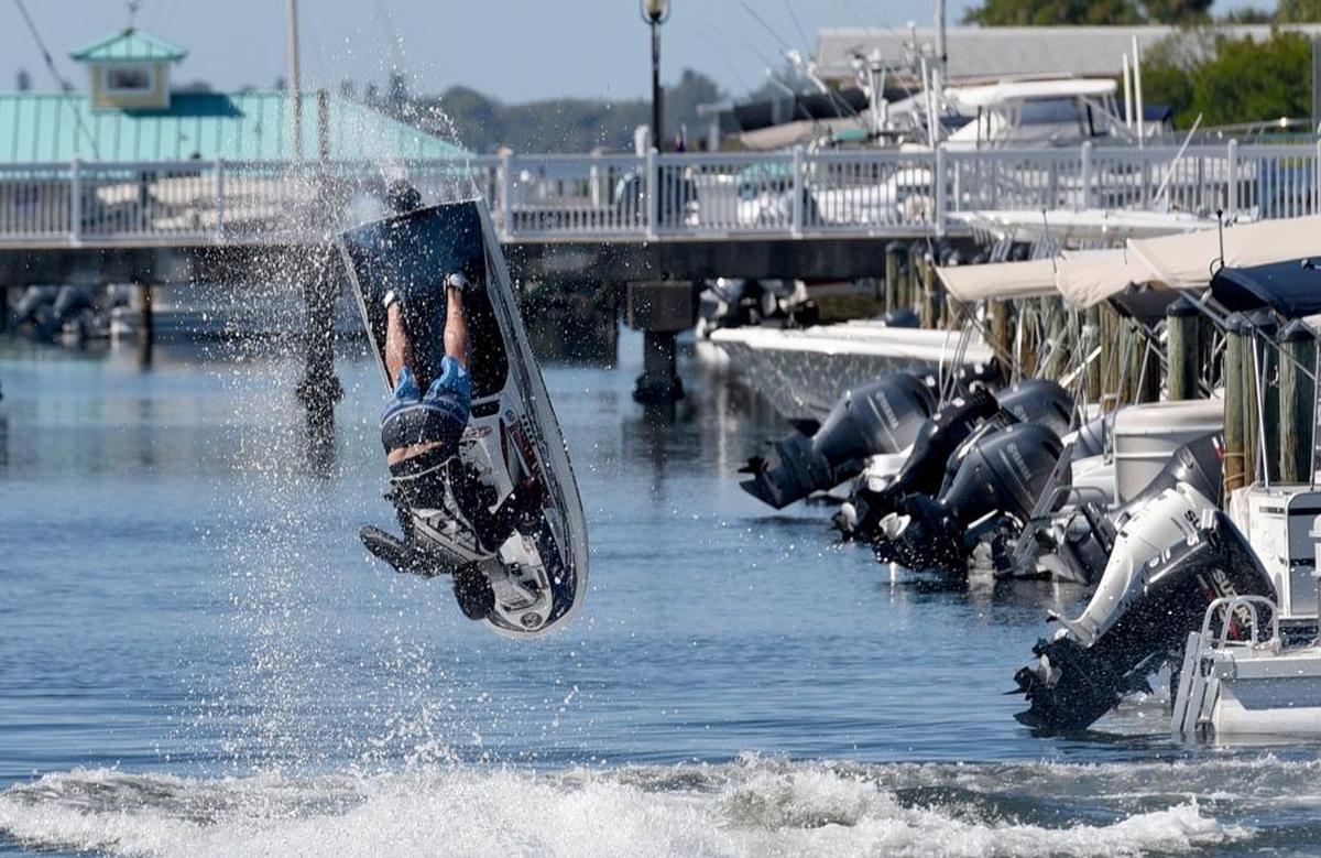 John Havell performs a trick on his action freestyle standing jet ski. The boat ramp in Palmetto was bustling as boats and jet skis unload in preparation for the Bradenton Area River Regatta on Saturday.