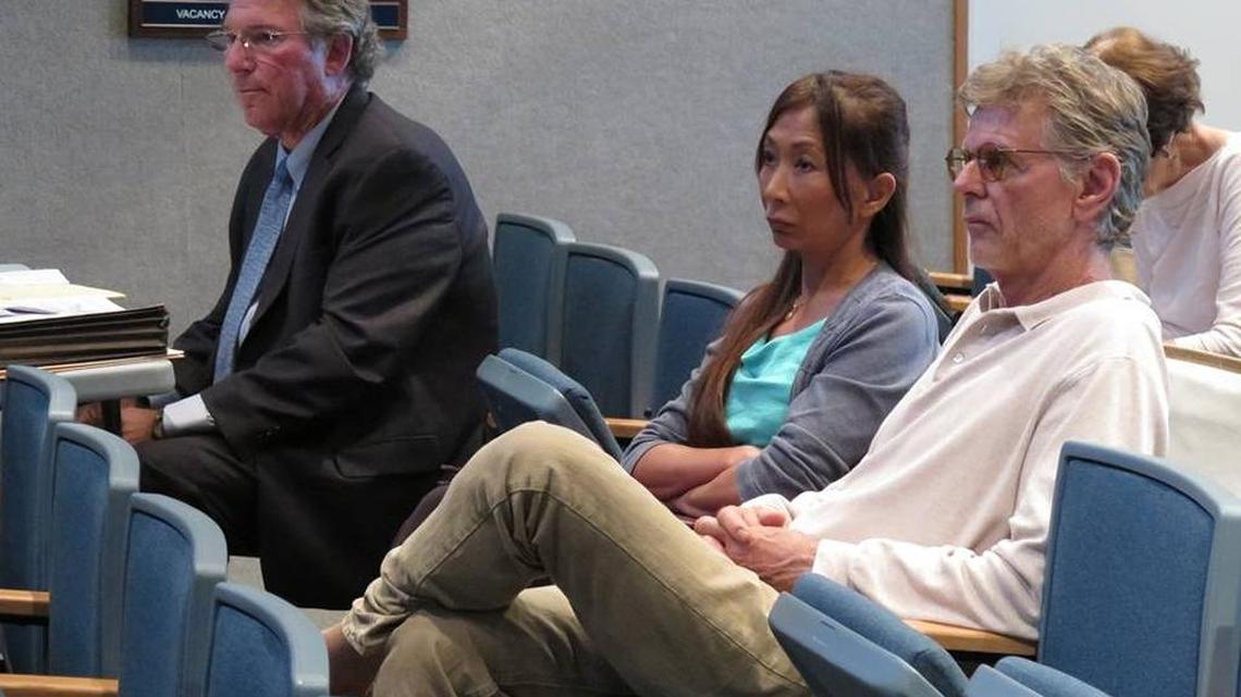 From left: Attorney David Levin, Lynn Tran and her husband, Richard Hazen, listen to testimony during a May public hearing at Holmes Beach City Hall in this file photo.