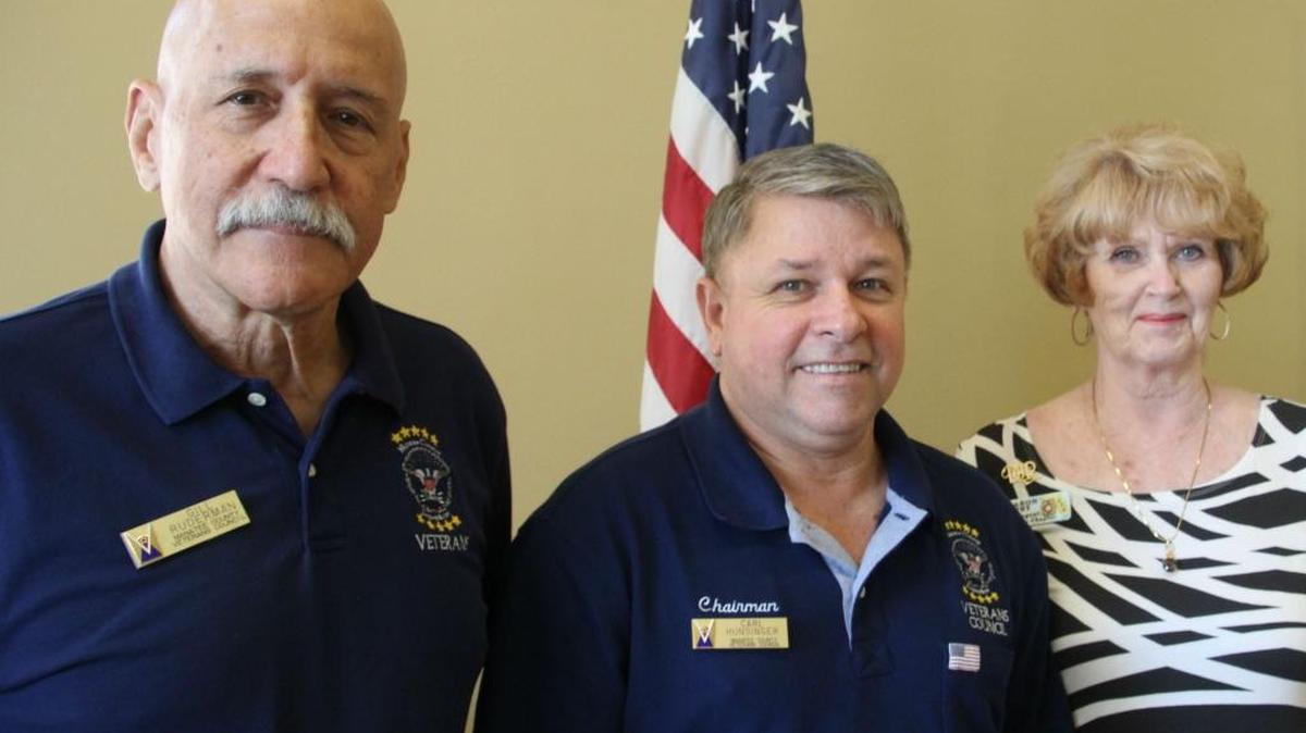 Gill Ruderman, left, and Sharon Spry have been recognized for their service to Manatee County veterans. At center is Manatee County Veterans Council Chair Carl Hunsinger.