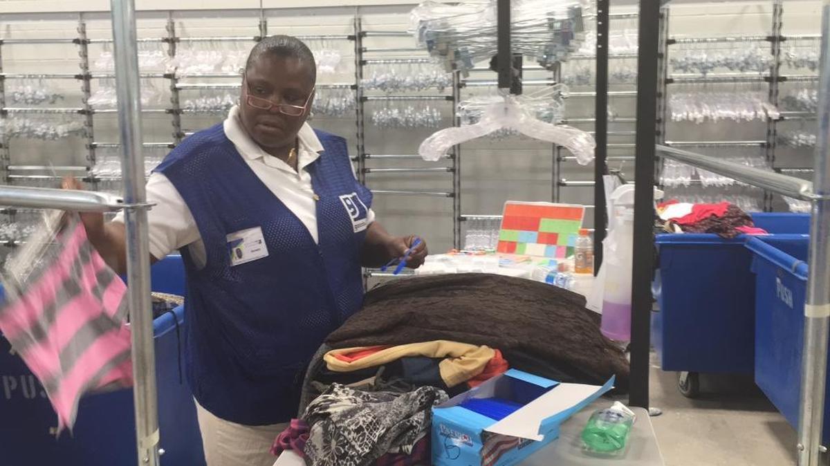 Goodwill Manasota employee Annett Brewer hangs up clothes Wednesday at the East Manatee store, 8750 E. State Road 70, Bradenton. Goodwill officials invited the media for a behind-the-scenes tour of a Goodwill Wednesday.